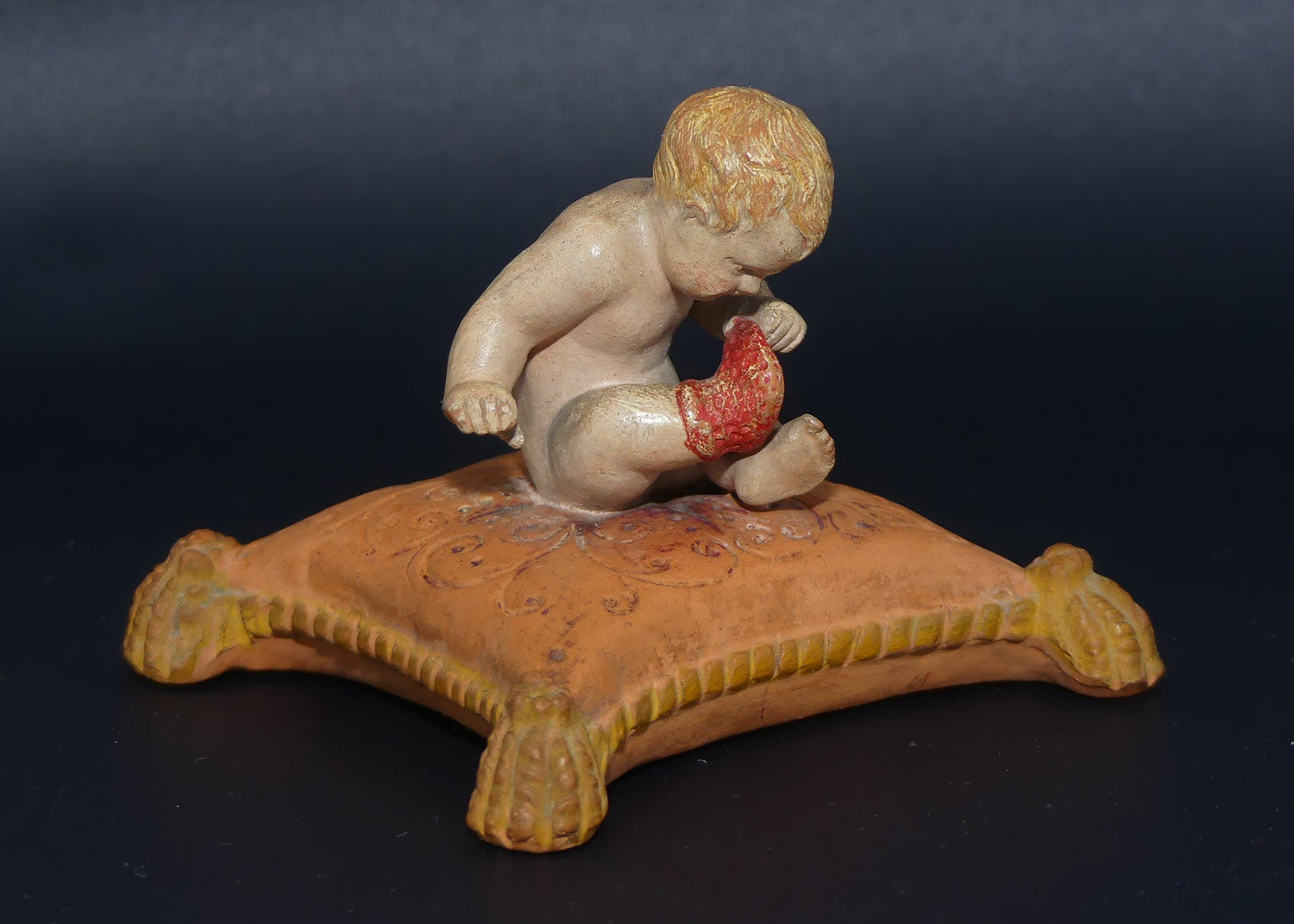 P. Ipsens Eneret terracotta figure of a baby on cushion | 442