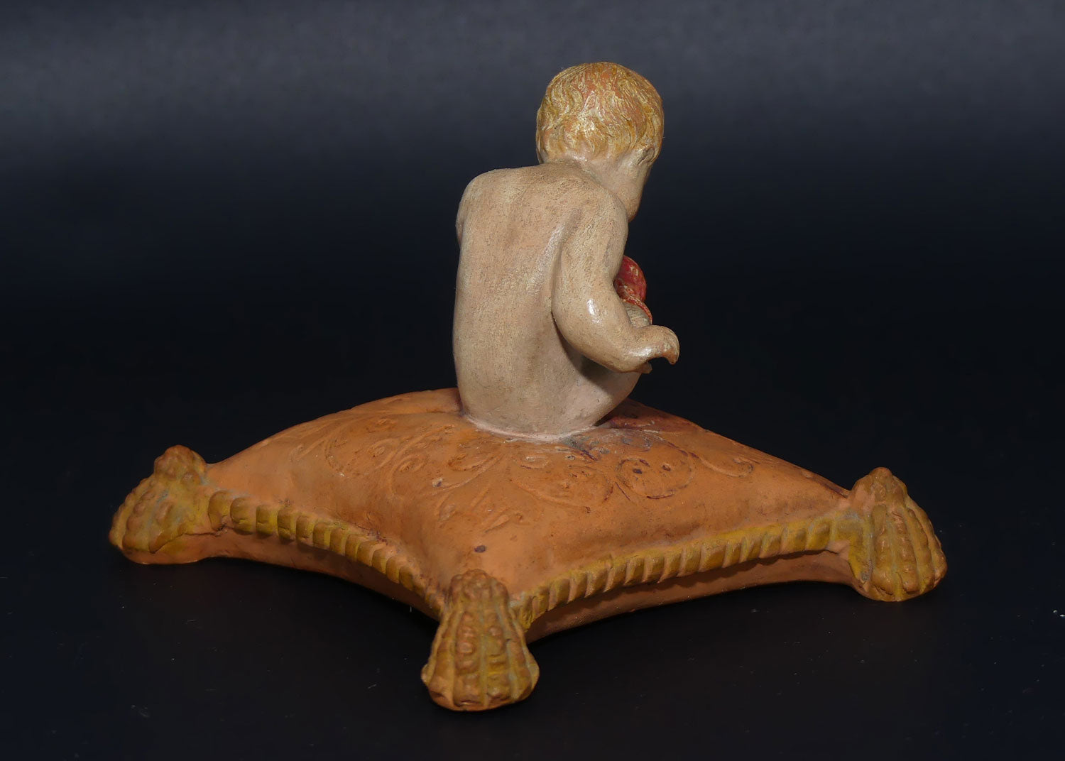 P. Ipsens Eneret terracotta figure of a baby on cushion | 442