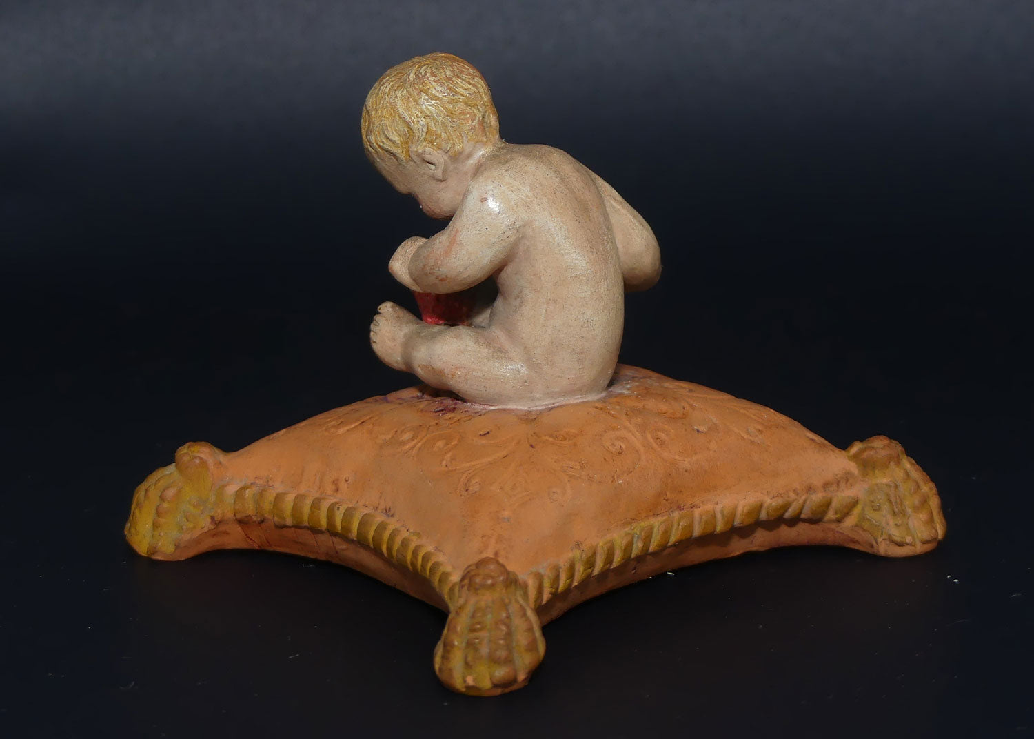 P. Ipsens Eneret terracotta figure of a baby on cushion | 442