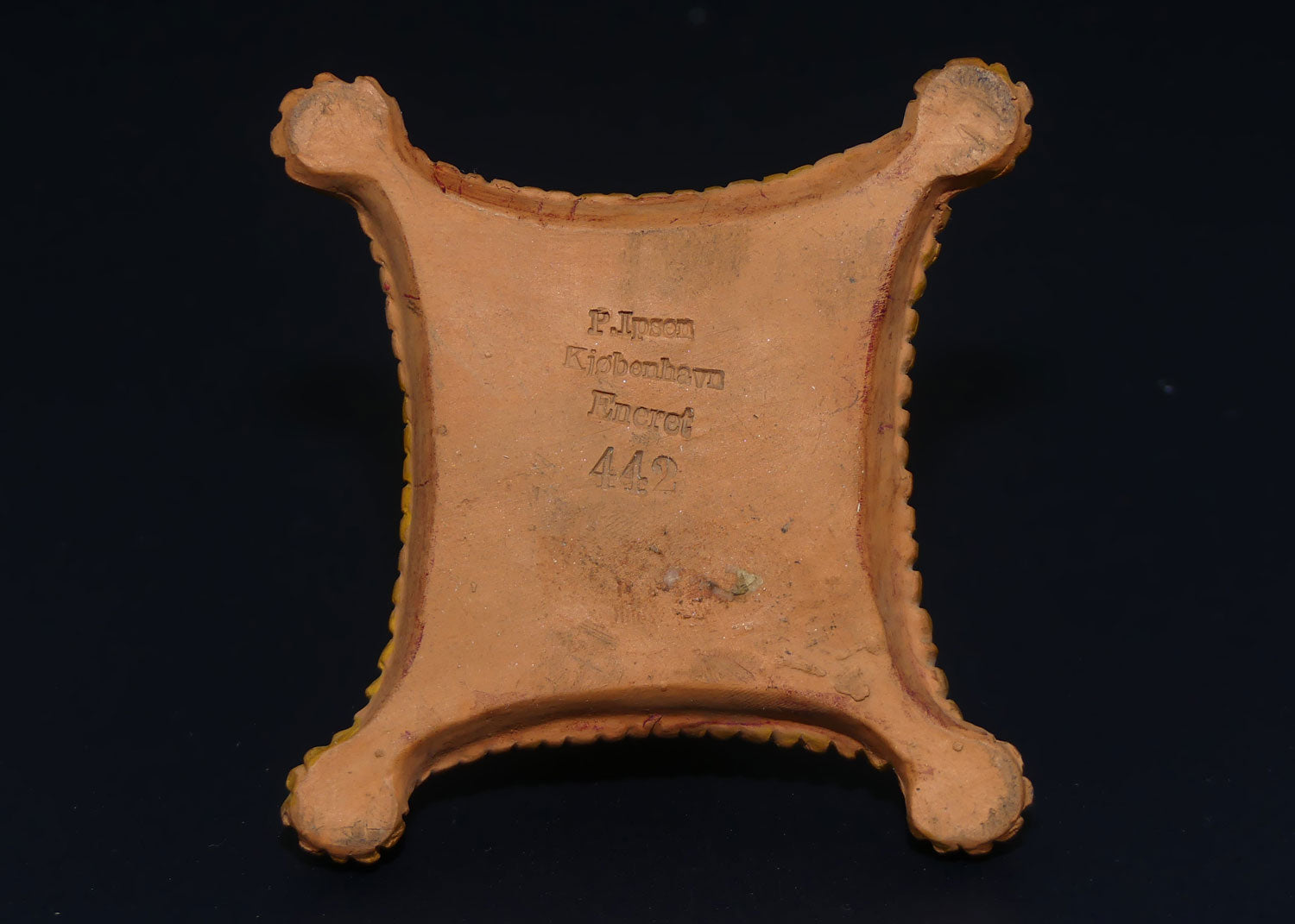 P. Ipsens Eneret terracotta figure of a baby on cushion | 442