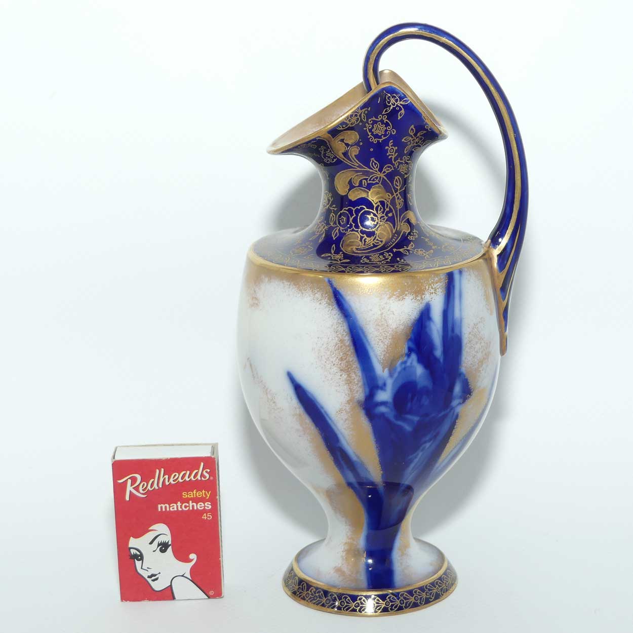 Doulton Burslem Blue Iris and Daffodil loop handle jug with gilt highlights