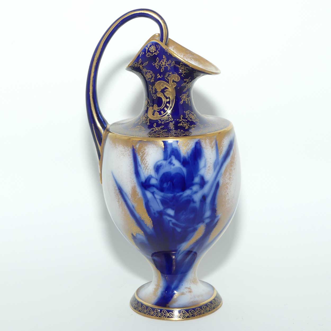 Doulton Burslem Blue Iris and Daffodil loop handle jug with gilt highlights