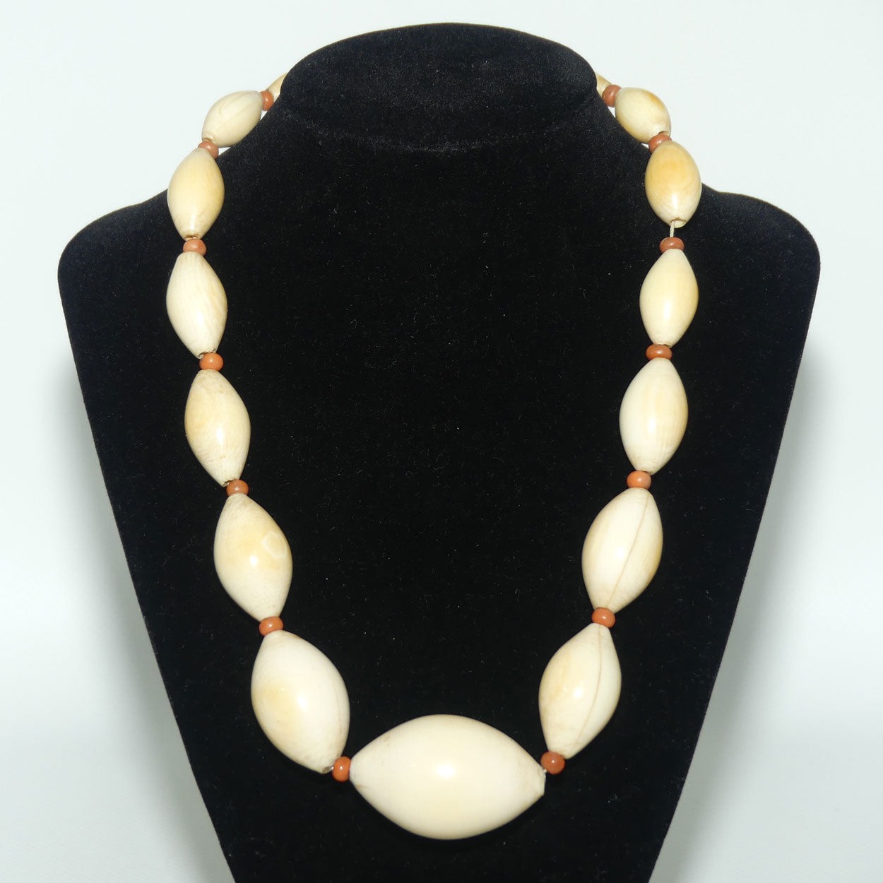 Very Heavy Antique set of Graduated Elongated Ivory Beads with feature Coral beads