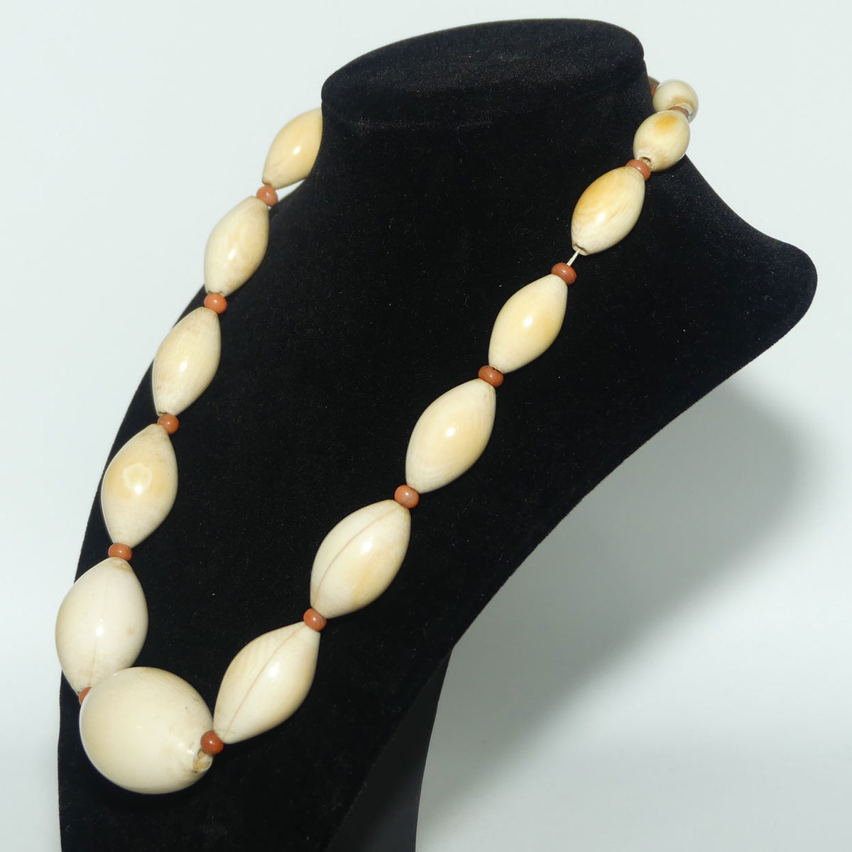 Very Heavy Antique set of Graduated Elongated Ivory Beads with feature Coral beads