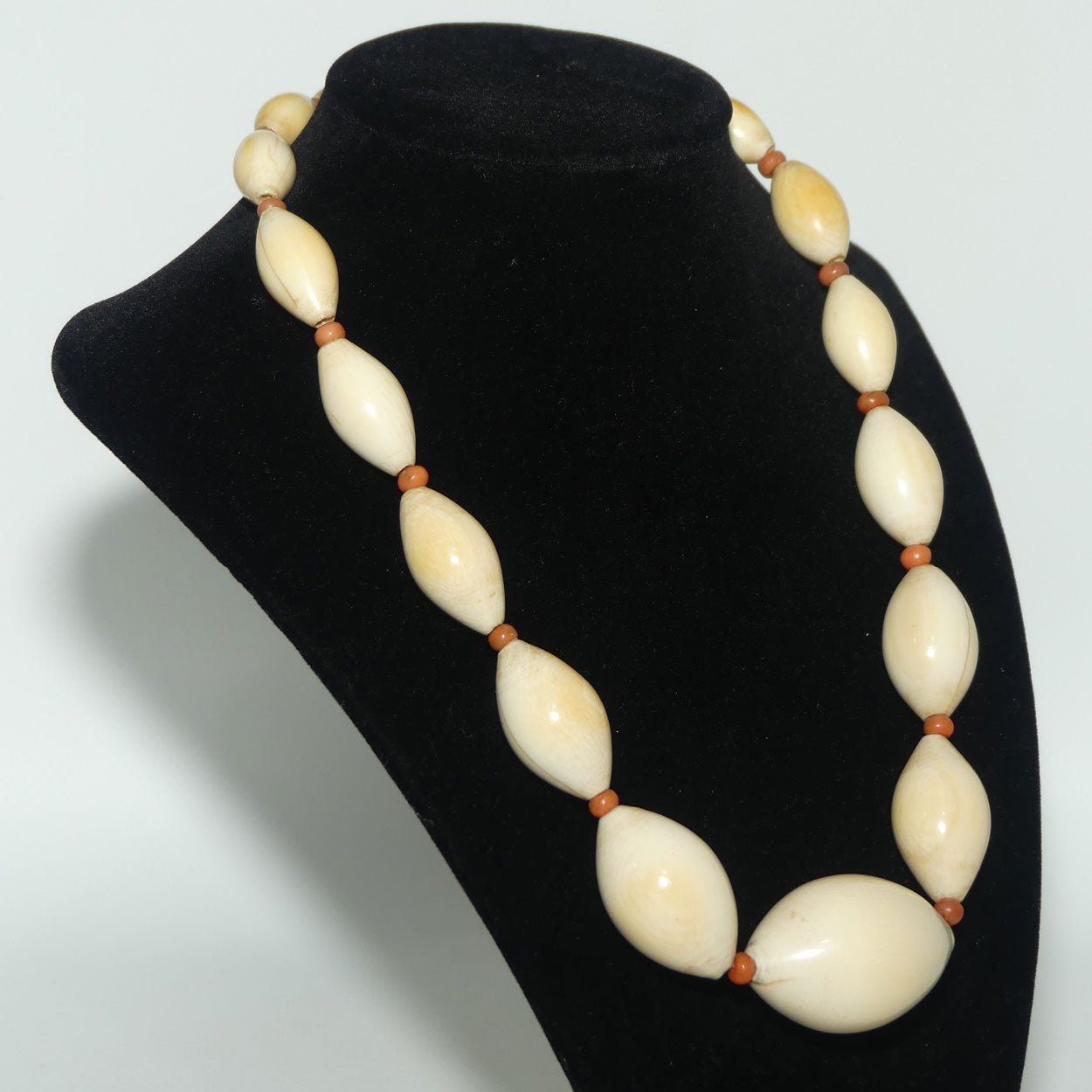 Very Heavy Antique set of Graduated Elongated Ivory Beads with feature Coral beads