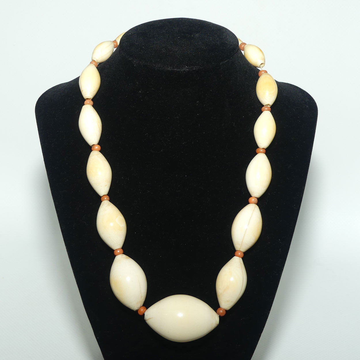 Very Heavy Antique set of Graduated Elongated Ivory Beads with feature Coral beads