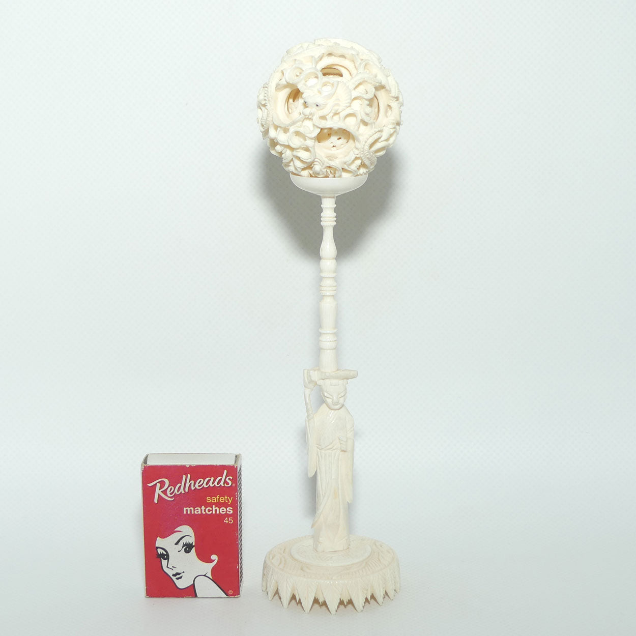 Carved Ivory Puzzle Ball on stand | Man with Staff | Dragon with Black Eyes | 20.5cm tall