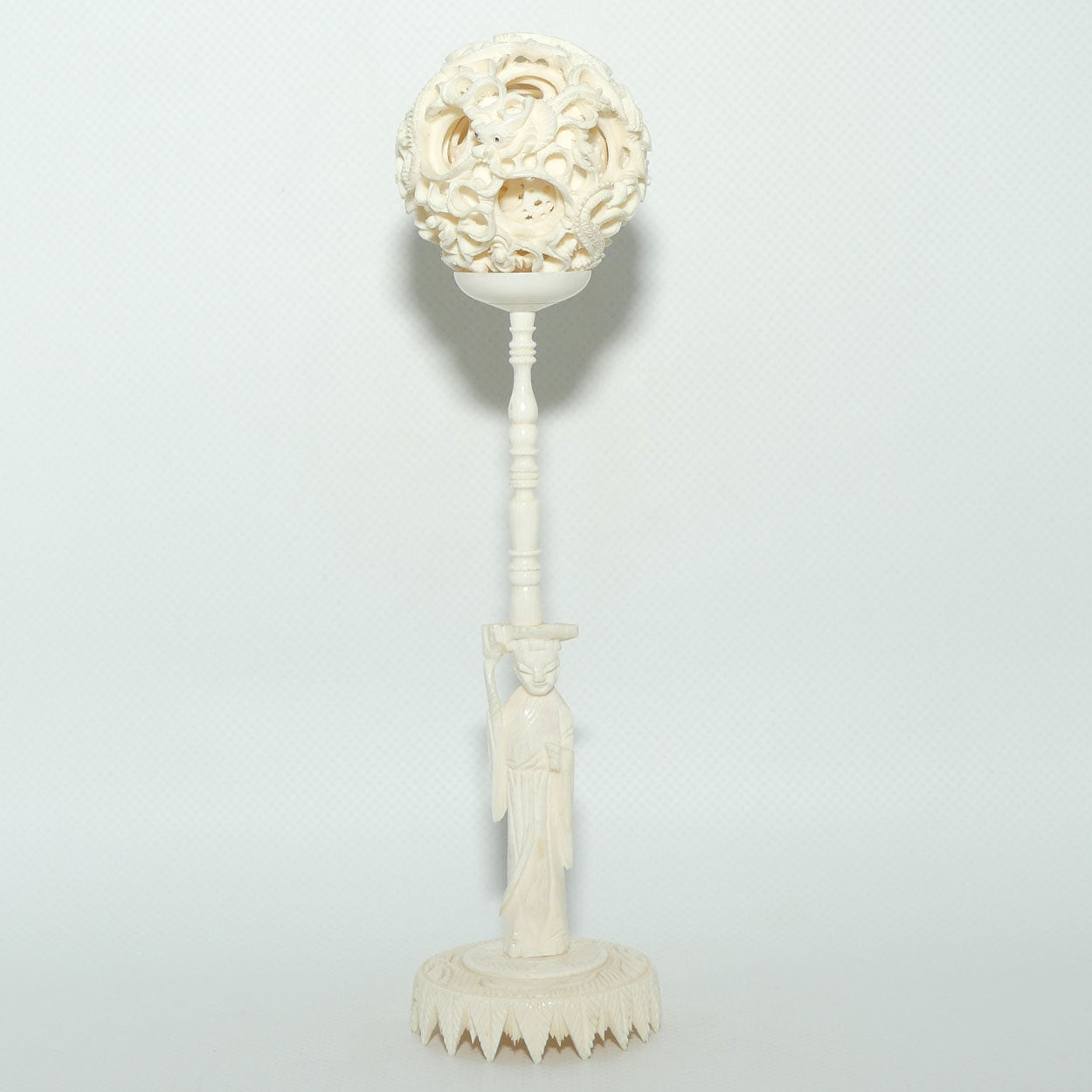Carved Ivory Puzzle Ball on stand | Man with Staff | Dragon with Black Eyes | 20.5cm tall