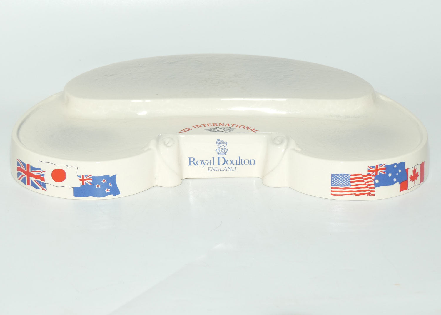 D- Royal Doulton small character jug The International Collection jug or liquor container stand