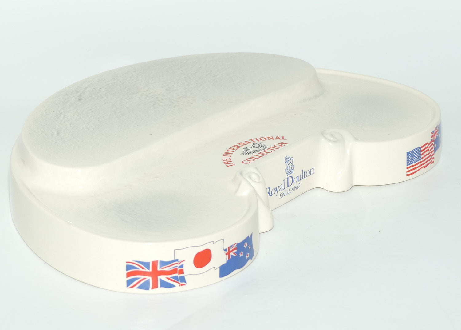 D- Royal Doulton small character jug The International Collection jug or liquor container stand