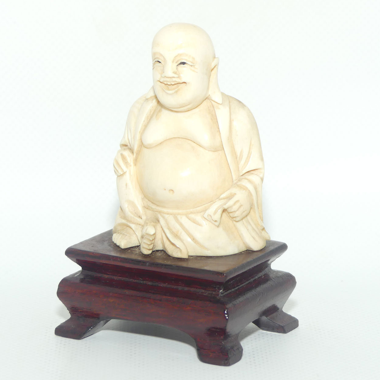 Beautifully carved Ivory Laughing Buddha Seated on Wooden Stand