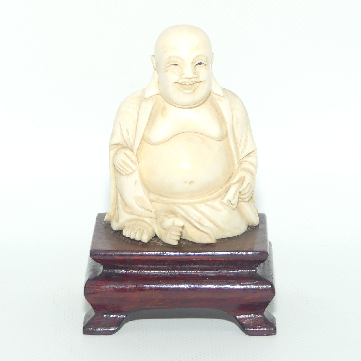 Beautifully carved Ivory Laughing Buddha Seated on Wooden Stand