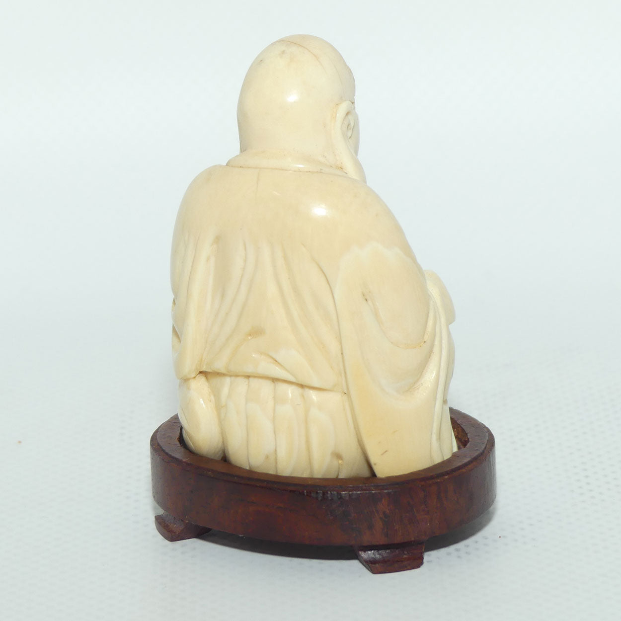 Beautifully carved Ivory Laughing Buddha Seated on Wooden Stand | signed | 7.5cm tall