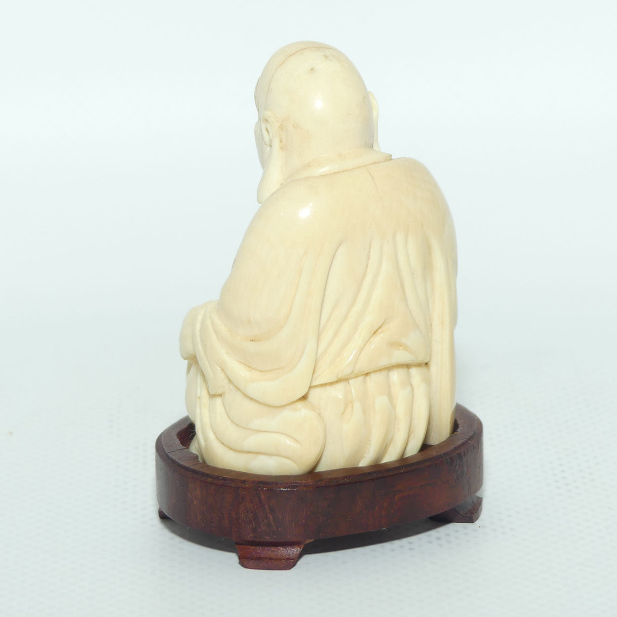 Beautifully carved Ivory Laughing Buddha Seated on Wooden Stand | signed | 7.5cm tall
