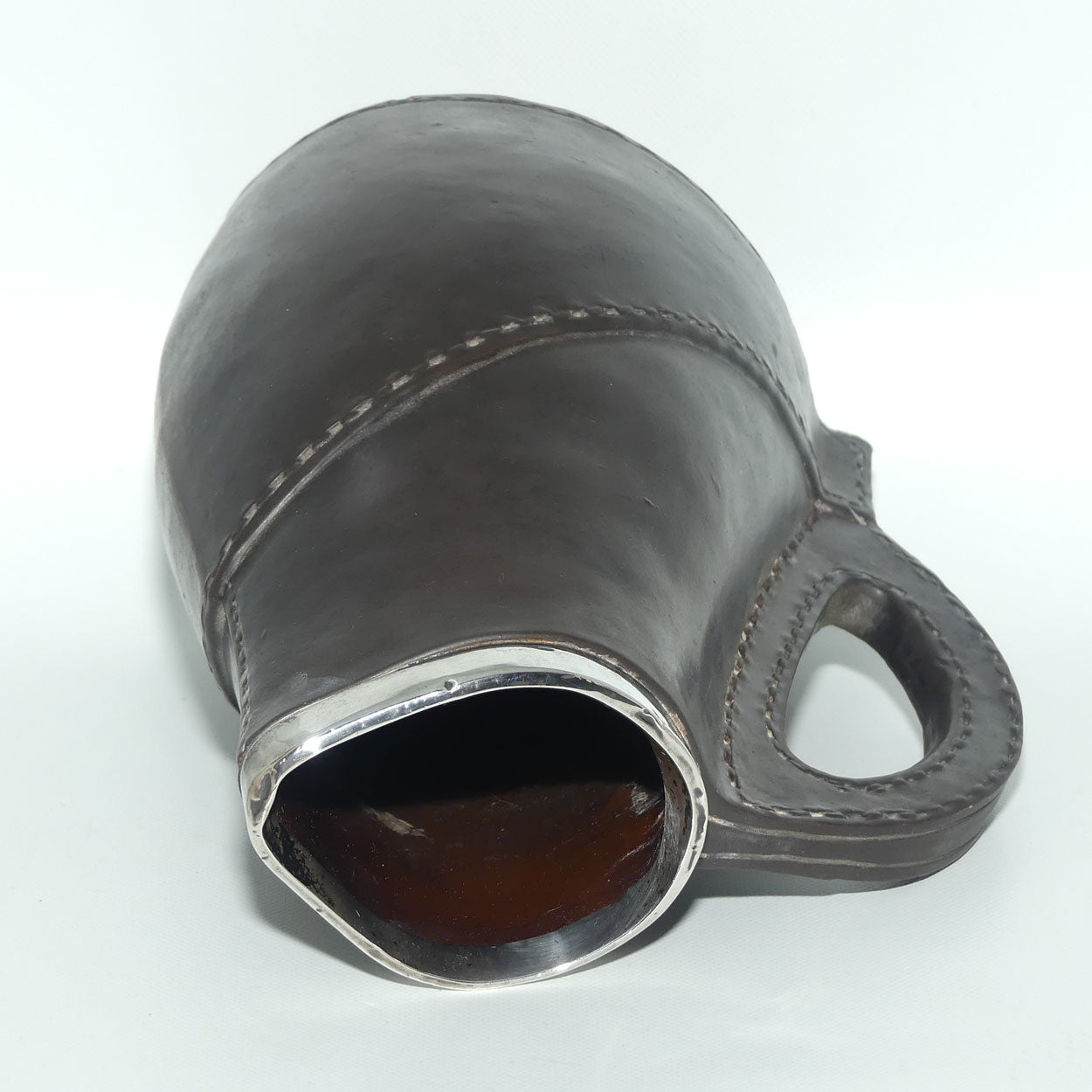 Doulton Lambeth England Leatherware jug with Sterling Silver rim