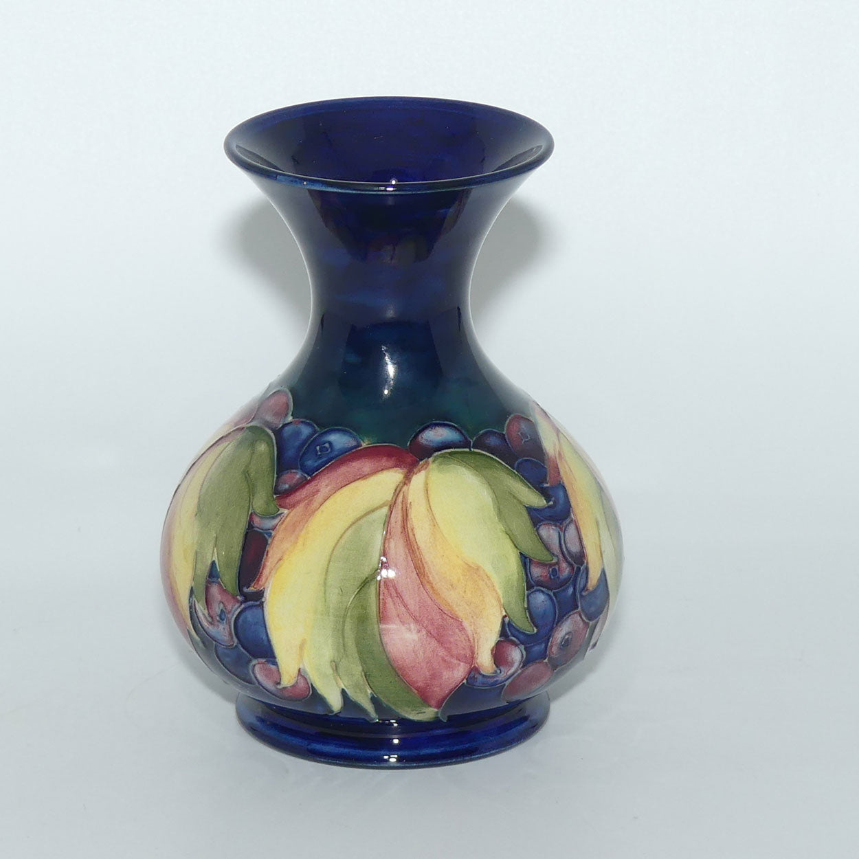 William Moorcroft Leaves and Fruit (Blue) flaired mouth vase