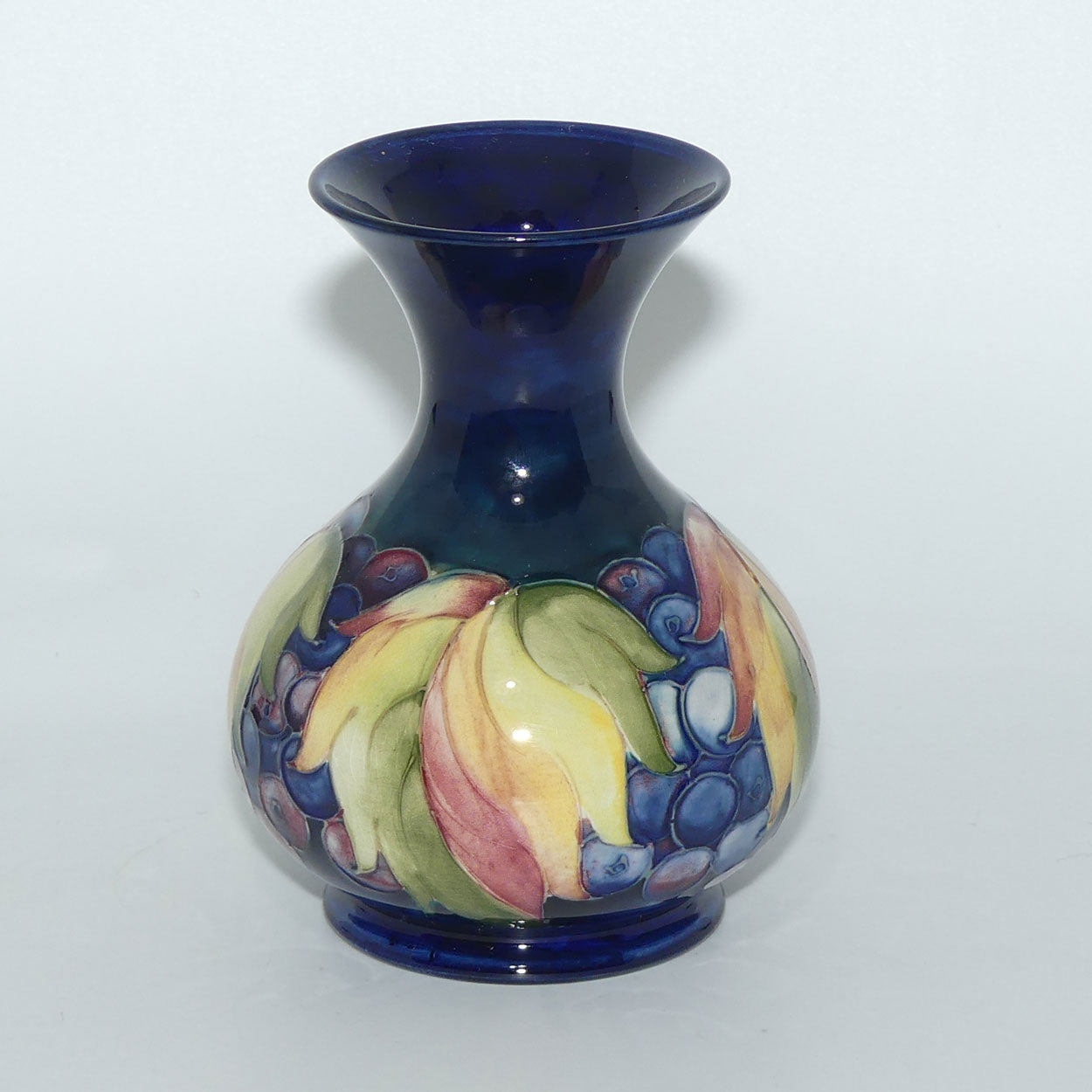 William Moorcroft Leaves and Fruit (Blue) flaired mouth vase