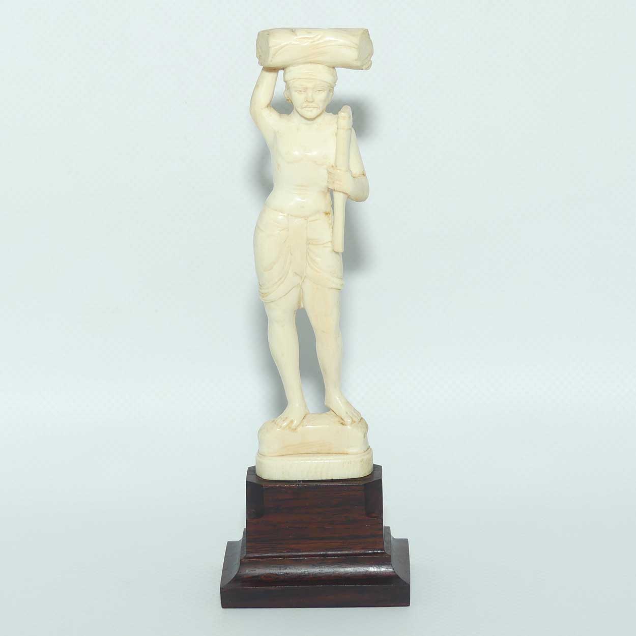 Carved Ivory Figure on Rosewood base | Man with Axe Carrying Log on Head | 17cm