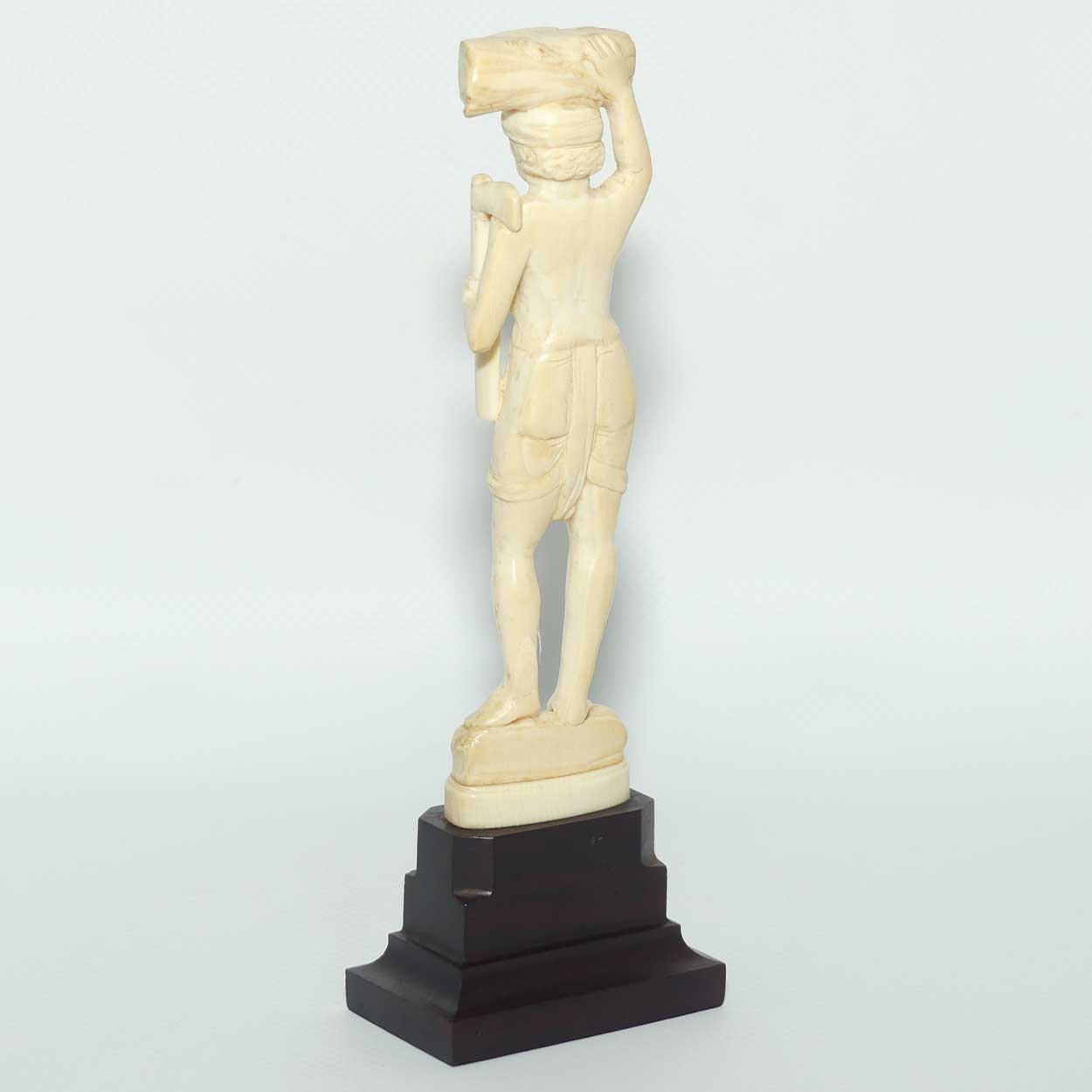 Carved Ivory Figure on Rosewood base | Man with Axe Carrying Log on Head | 17cm