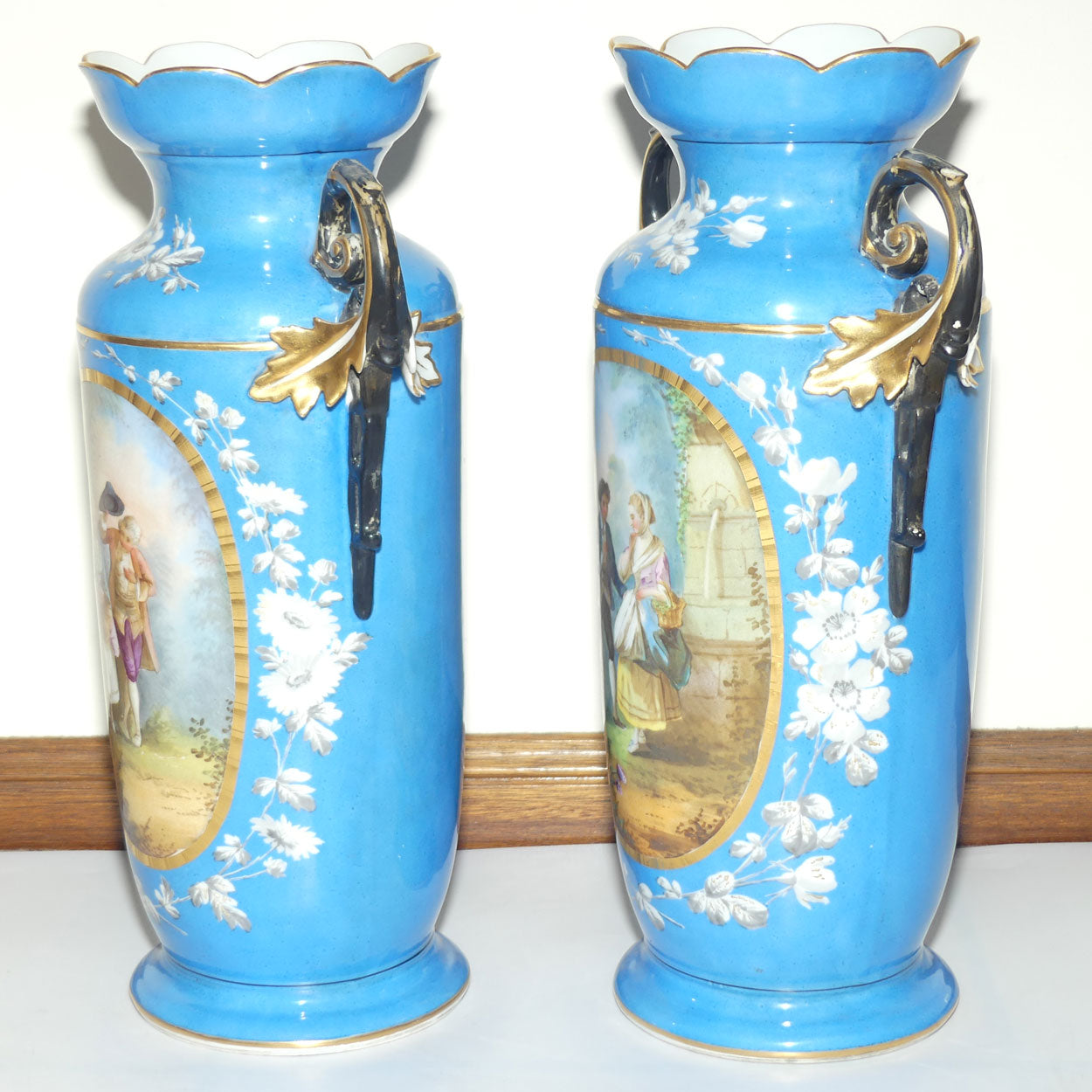 Pair of Continental European mantle vases with courting couple scenes c.1890