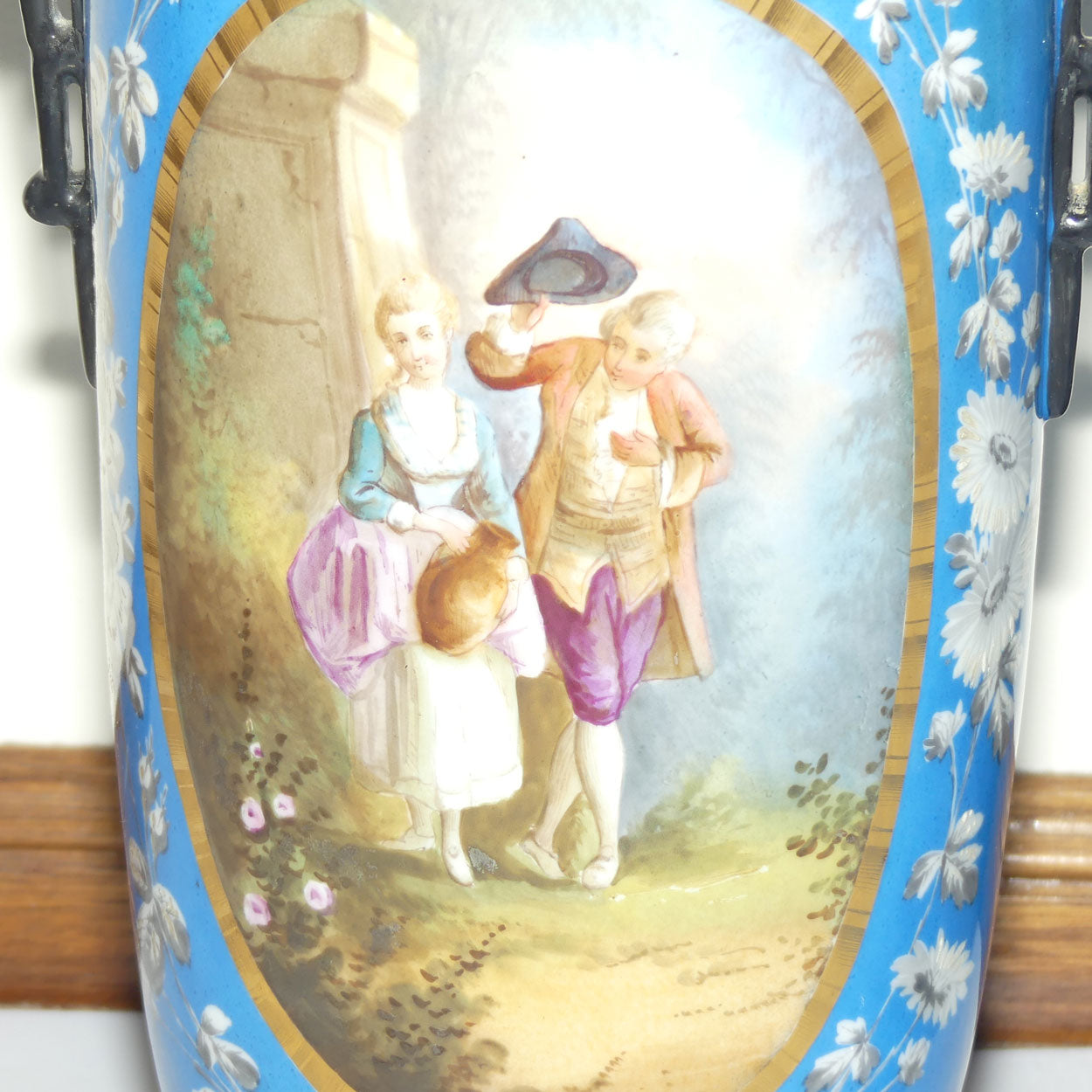 Pair of Continental European mantle vases with courting couple scenes c.1890