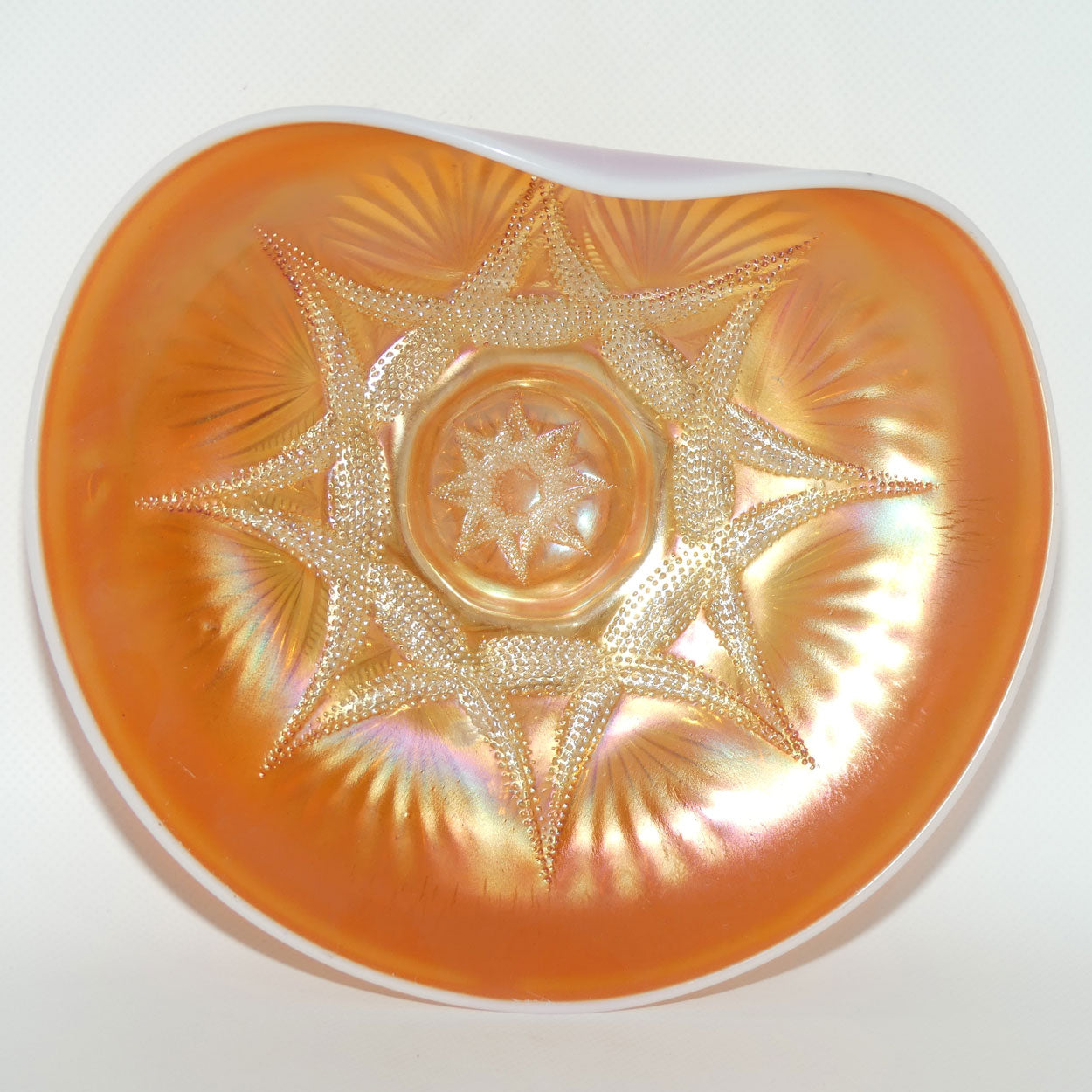 Dugan Carnival Glass | Ski Star pattern | Peach Opalescent colour