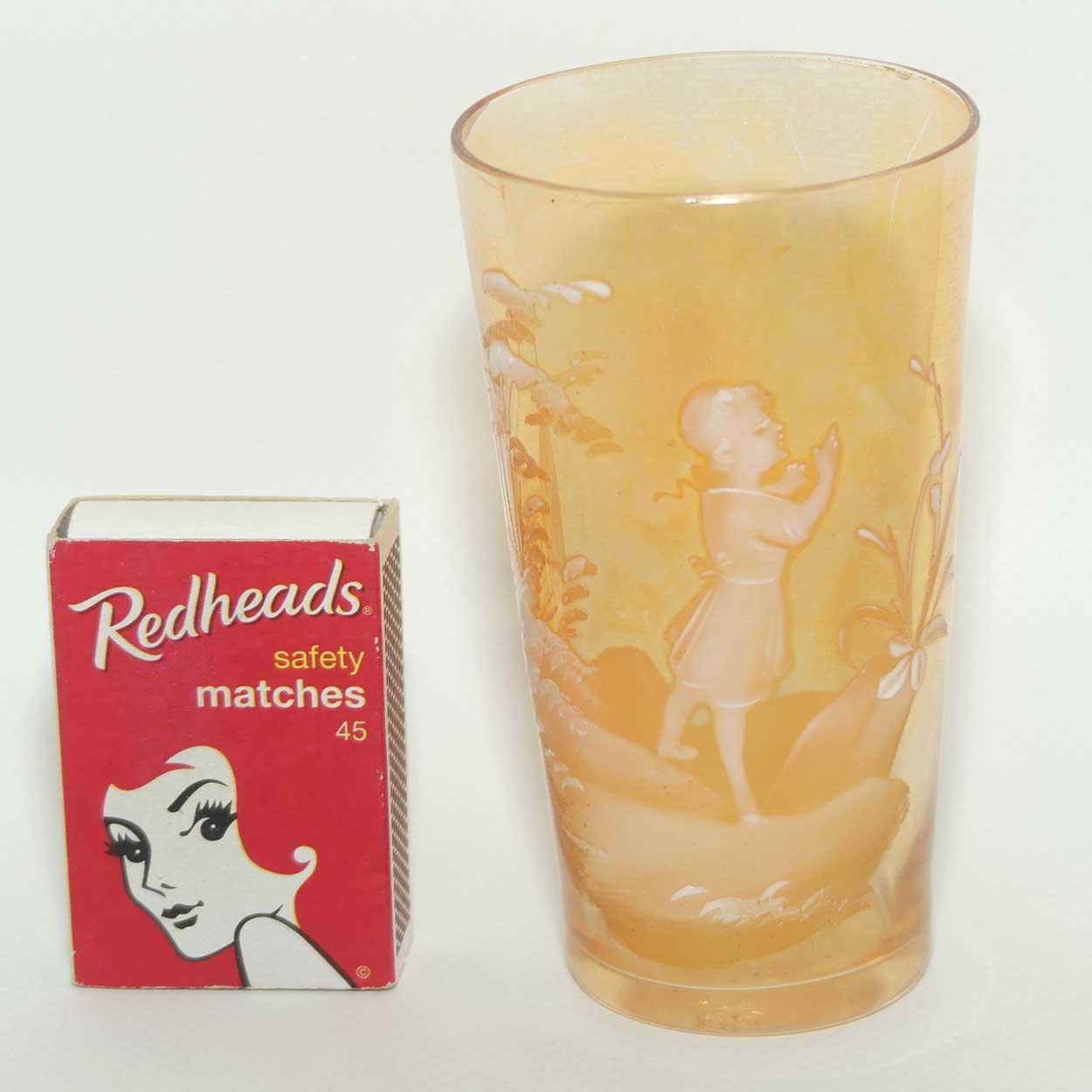 Mary Gregory on Marigold Iridescent glass tumbler | Girl walking