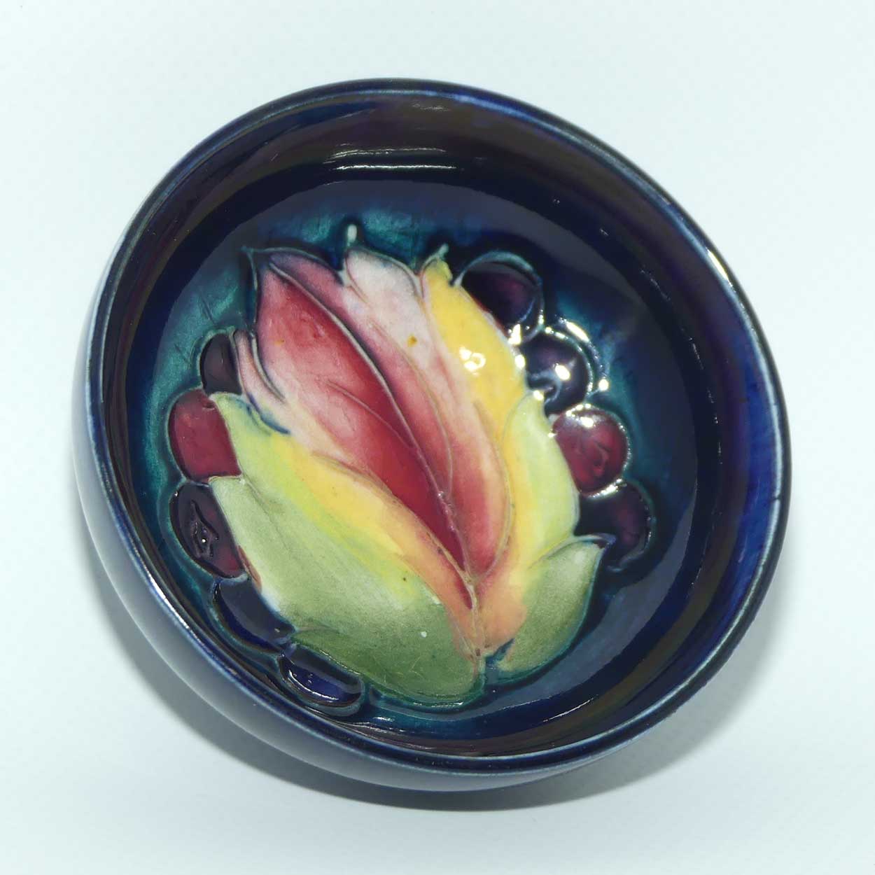 Walter Moorcroft Leaf and Fruit with Blue ground miniature footed bowl | 7.9cm diam