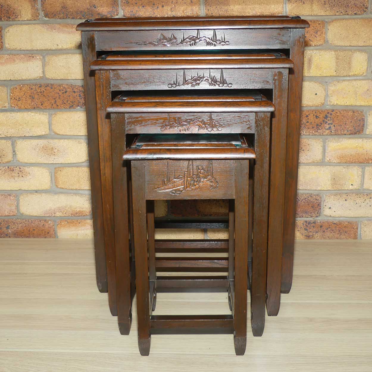 Chinese Carved Nest of 4 Occasional tables with Glass tops