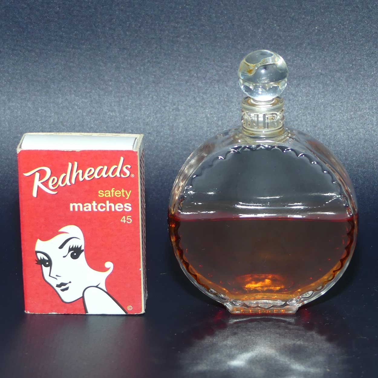 Nina Ricci L'air du Temps 1948 round perfume bottle with stopper and partial contents by Lalique France