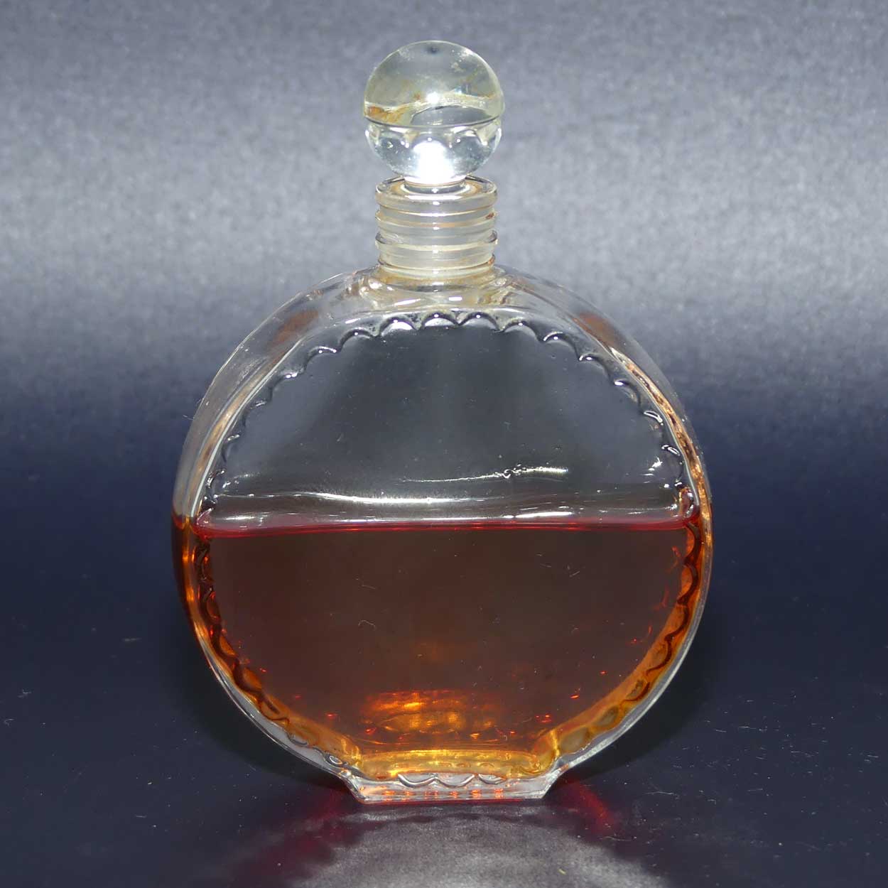 Nina Ricci L'air du Temps 1948 round perfume bottle with stopper and partial contents by Lalique France