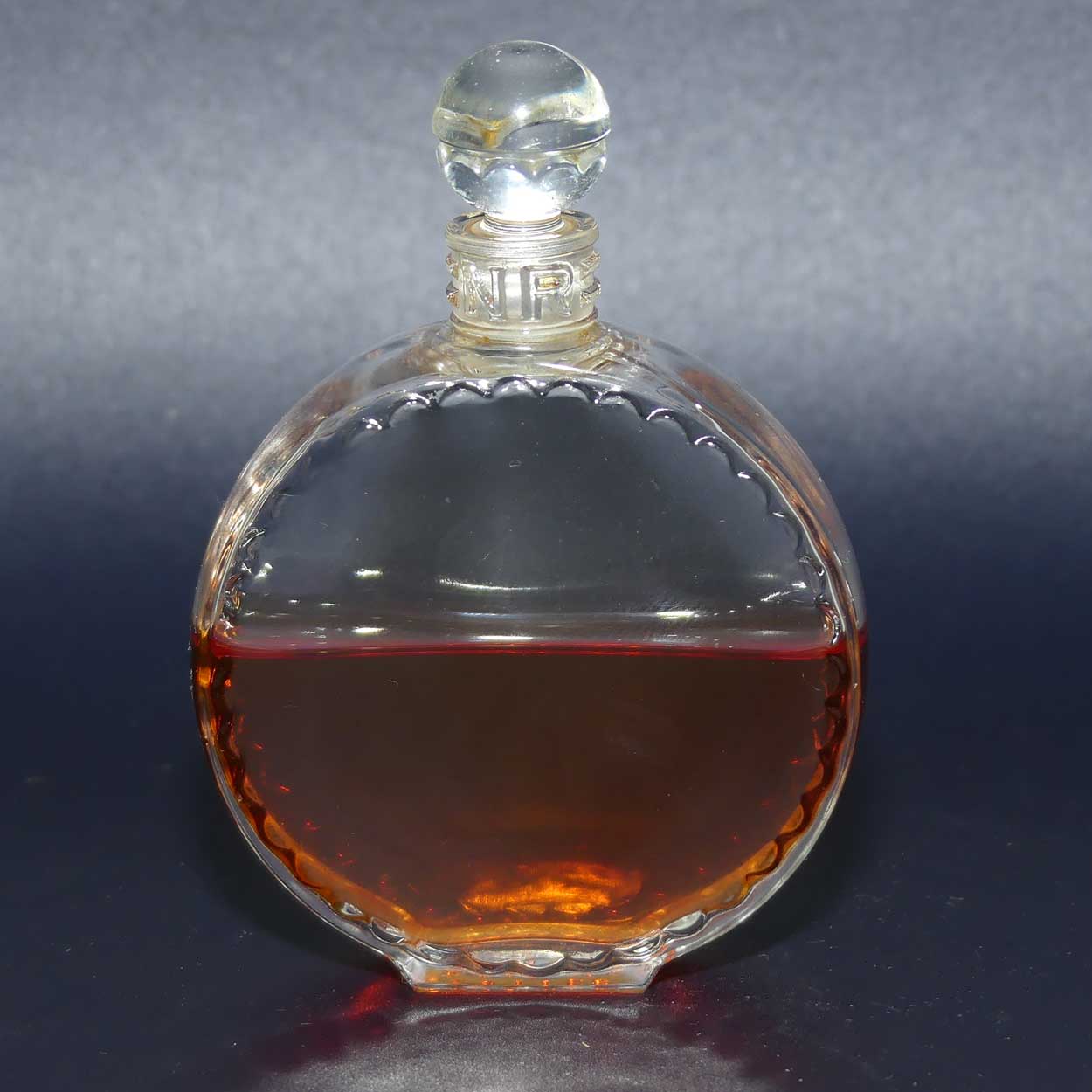 Nina Ricci L'air du Temps 1948 round perfume bottle with stopper and partial contents by Lalique France