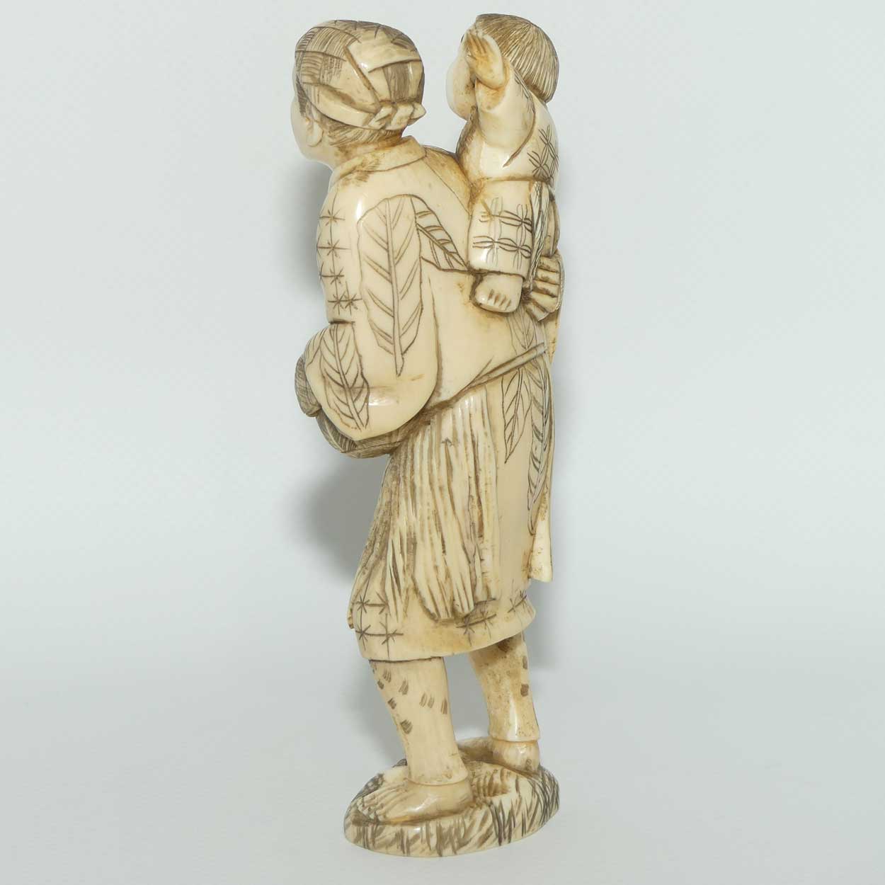 Japanese Carved Ivory Okimono figure | Father and Son Fisherman