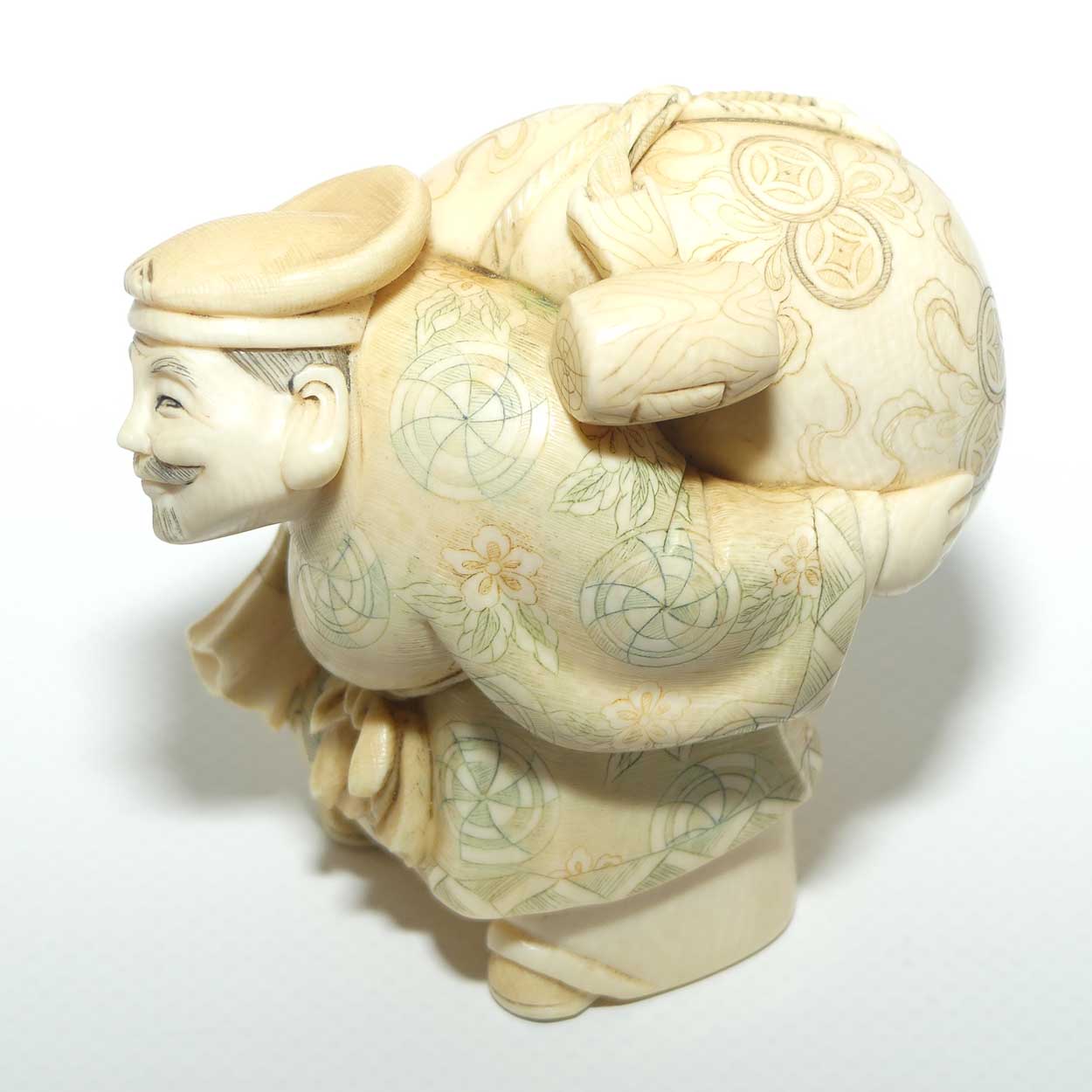 Japanese Carved Ivory Okimono figure | Travelling Man Carrying large Sack