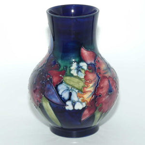 Walter Moorcroft Orchid on Blue Ground bulbous vase | Medium