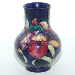 Walter Moorcroft Orchid on Blue Ground bulbous vase | Medium