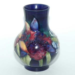 Walter Moorcroft Orchid on Blue Ground bulbous vase | Medium