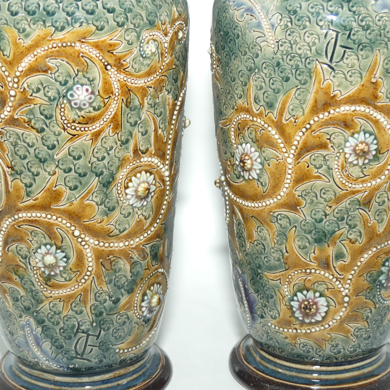 Doulton Lambeth George Tinworth stoneware pair of conical vases with applied baguette beads and foliage