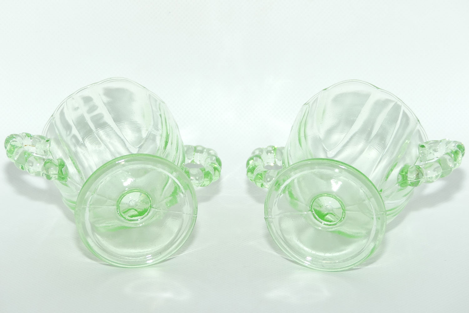 Pair of Ribbed handle Green Glass footed vases | 9.5cm tall