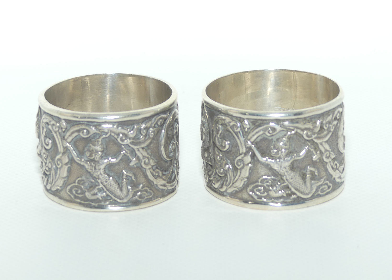 Pair of Heavily Embossed Siam Sterling Silver napkin or serviette rings | 52.15g the pair