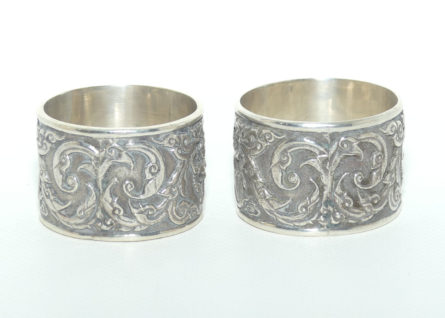 Pair of Heavily Embossed Siam Sterling Silver napkin or serviette rings | 52.15g the pair