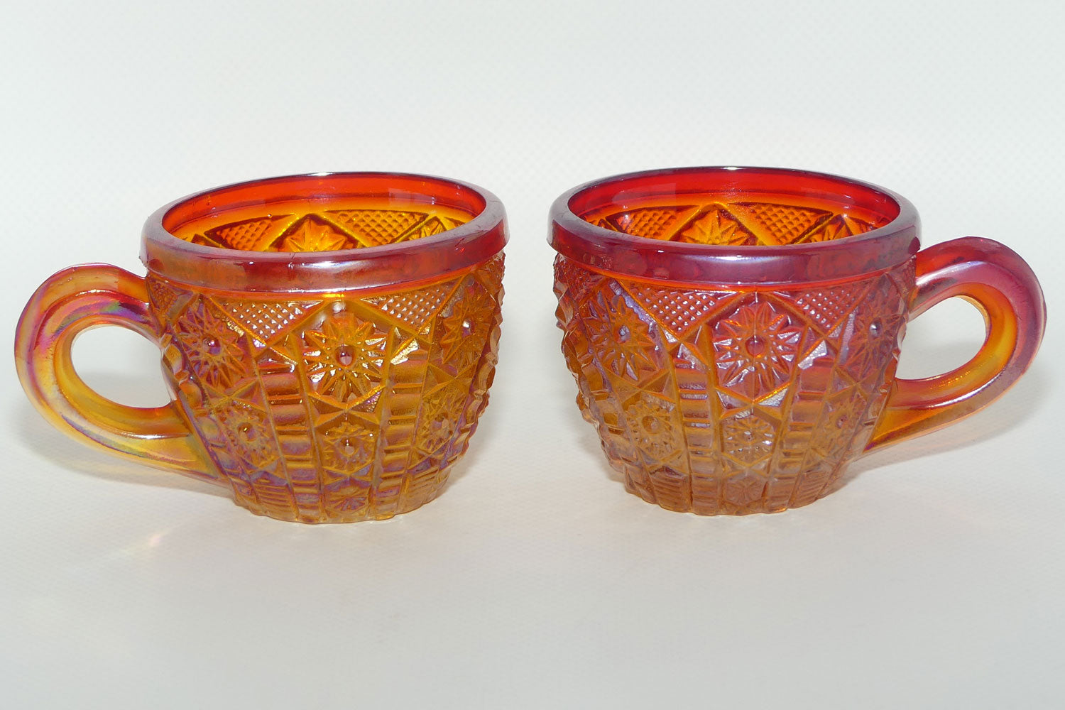 Pair of Indiana Carnival Glass cups | Red Amberina | Heirloom pattern