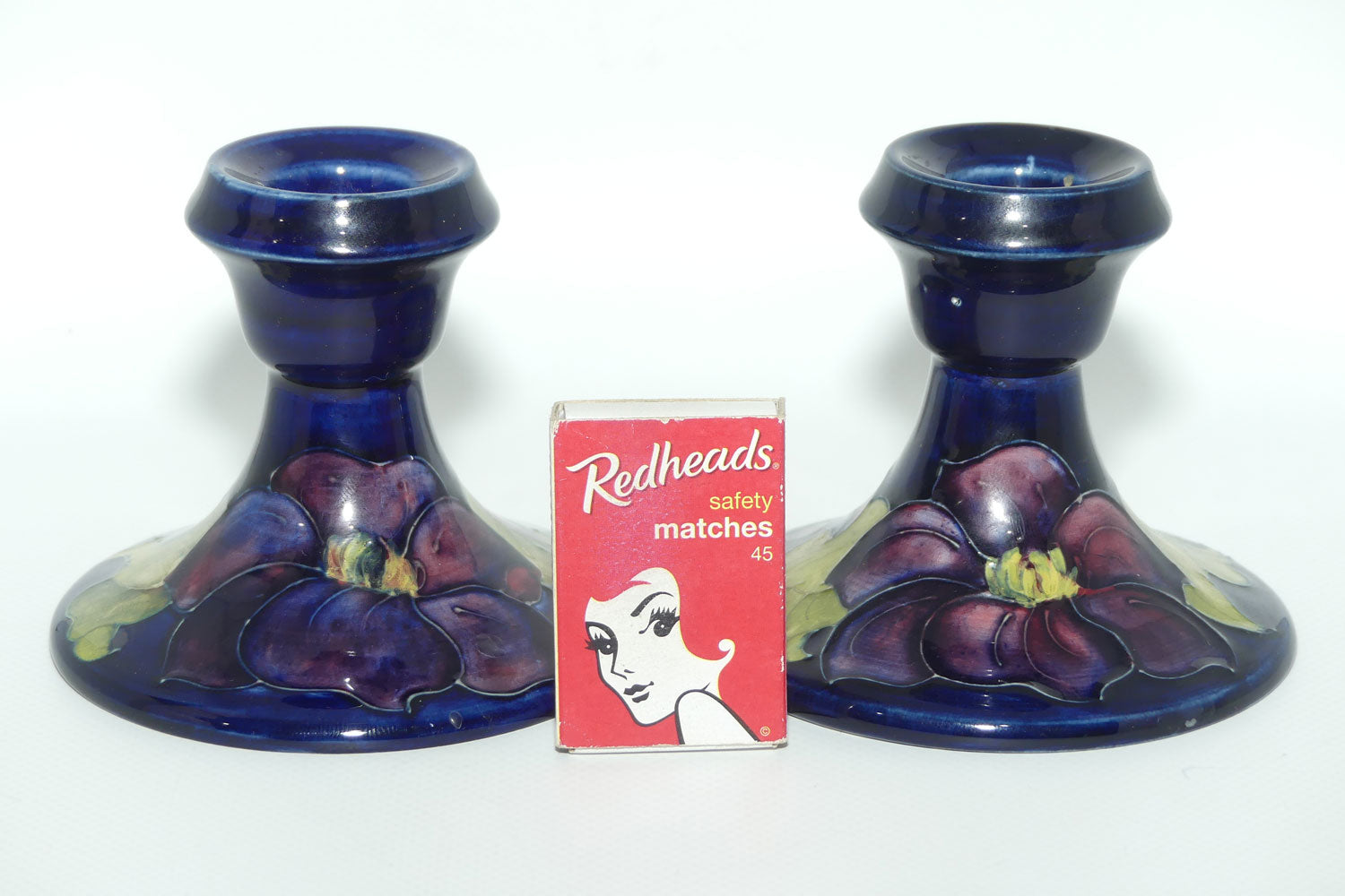 Walter Moorcroft Purple Clematis with Blue ground pair of candle holders