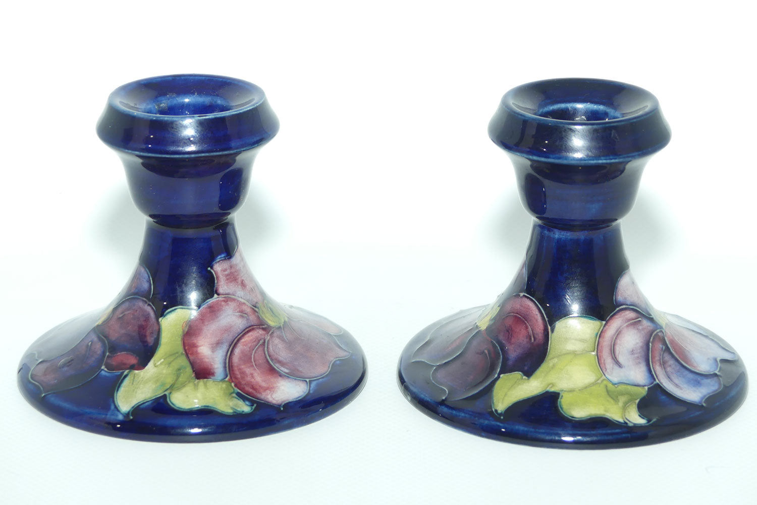 Walter Moorcroft Purple Clematis with Blue ground pair of candle holders