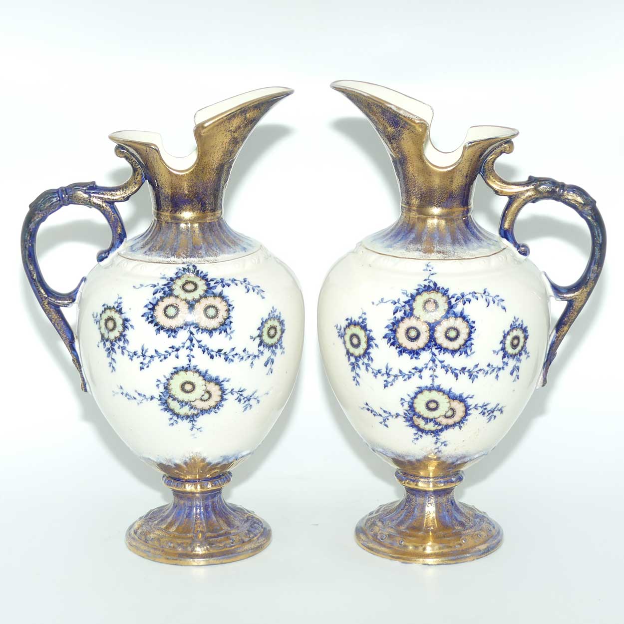 Pair of Flow Blue and Gilt Staffordshire floral decorated ewers