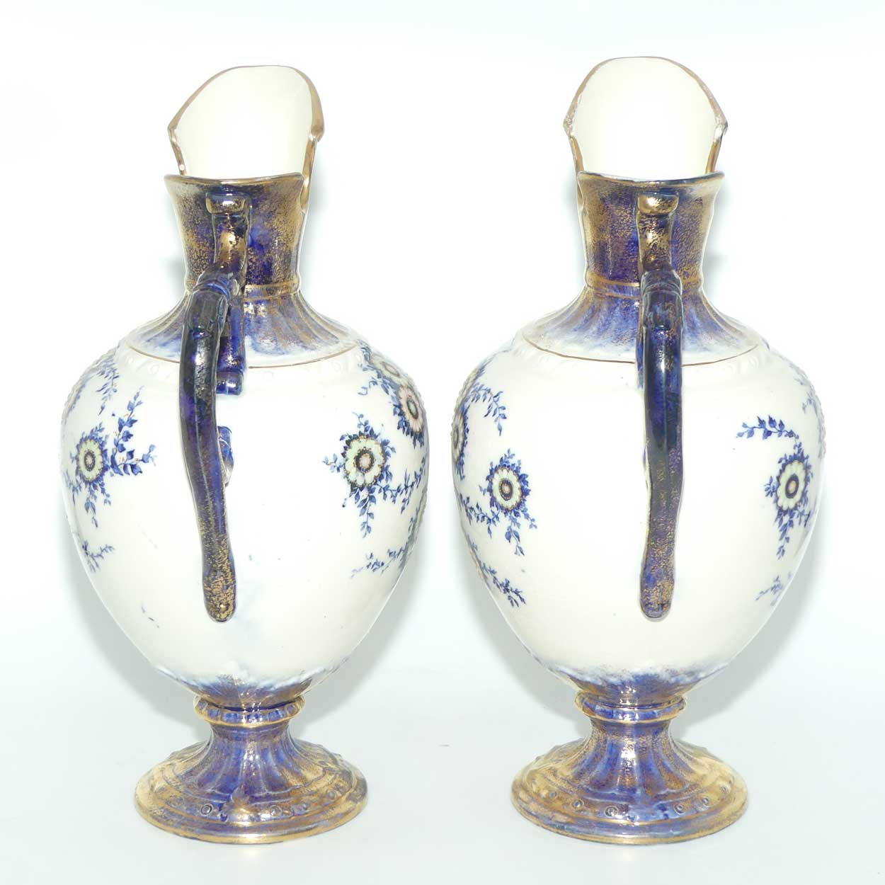 Pair of Flow Blue and Gilt Staffordshire floral decorated ewers