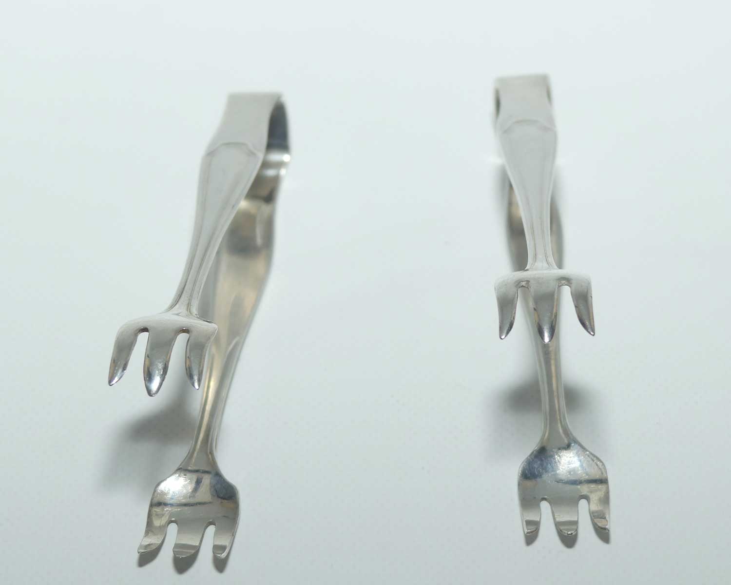 Two sets of small Silver Plated EPNS claw type sugar tongs