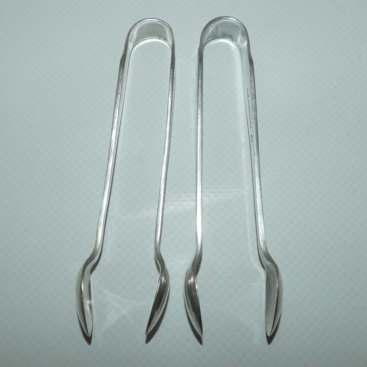 Matched Pair of Walker Hall & Sons silver plated sugar tongs