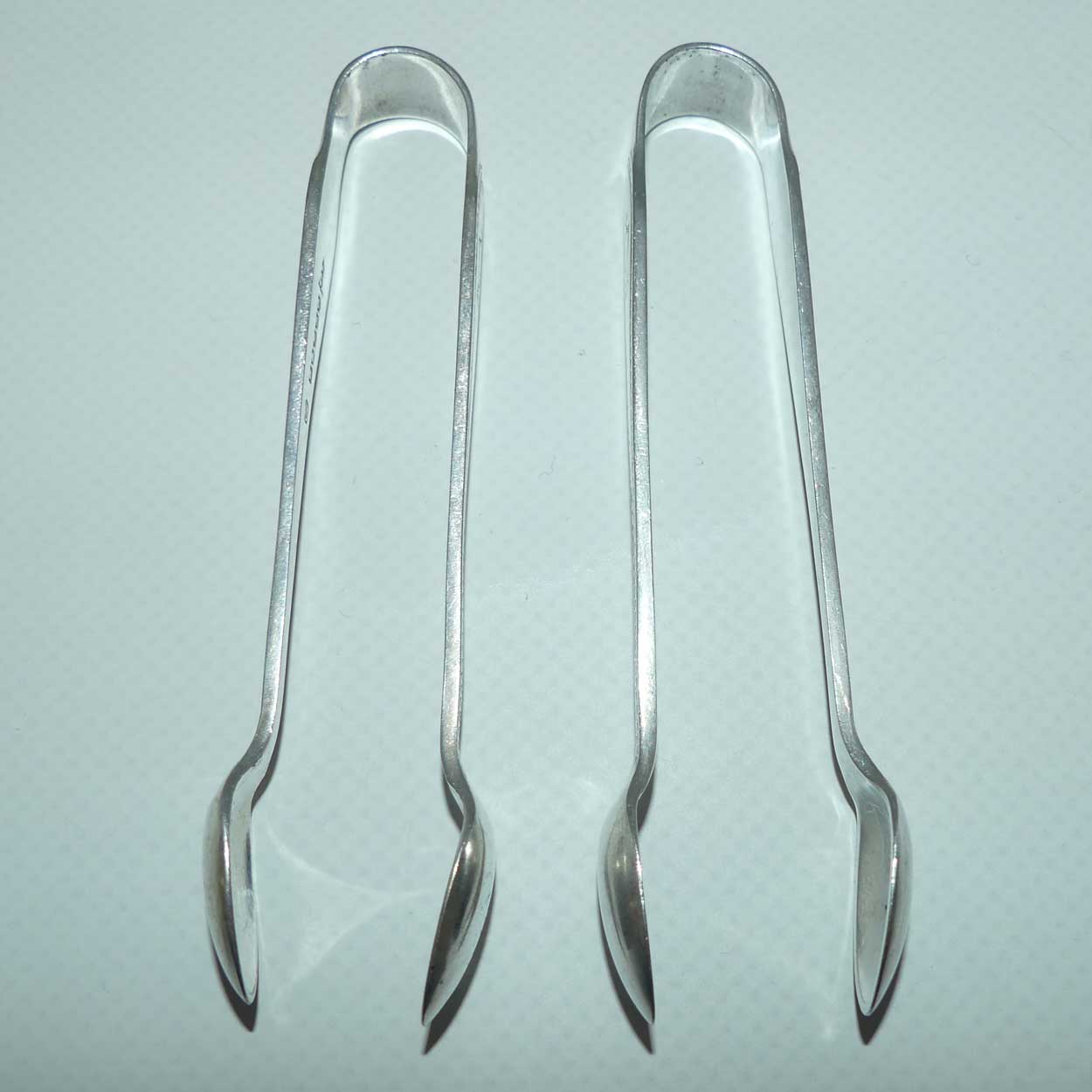 Matched Pair of Walker Hall & Sons silver plated sugar tongs
