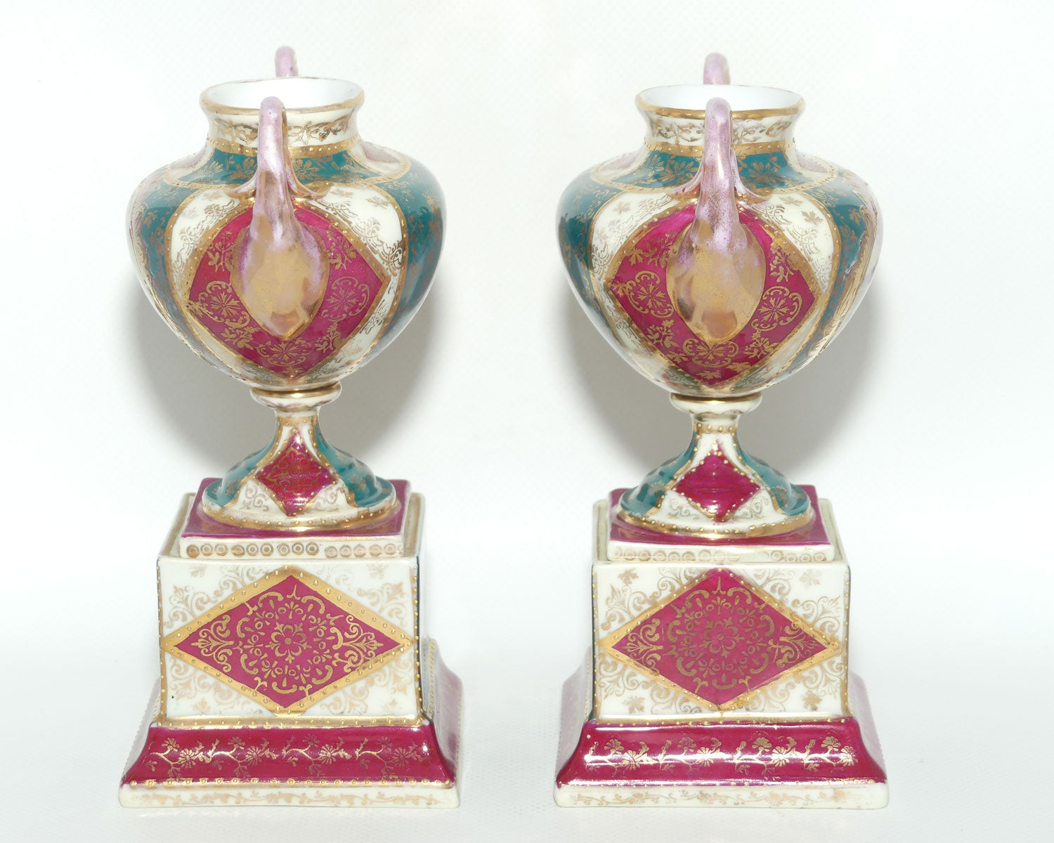 Royal Vienna pair of smaller twin handle cabinet vases on plinths